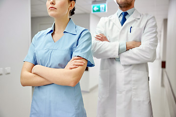 Image showing close up of doctor and nurse at hospital corridor