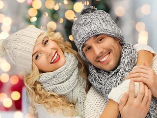 Image showing happy family couple in winter clothes hugging