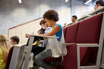 Image showing group of students with notebooks at lecture hall