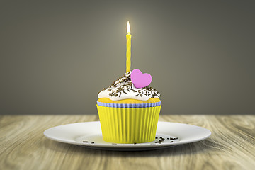 Image showing delicious cupcake with a burning candle