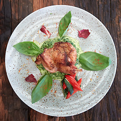 Image showing cooked rabbit meat with spinach and raisins