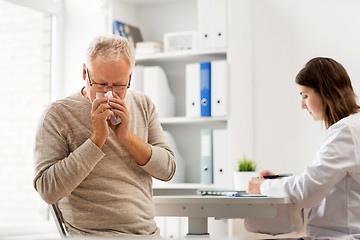 Image showing senior man and doctor meeting at hospital