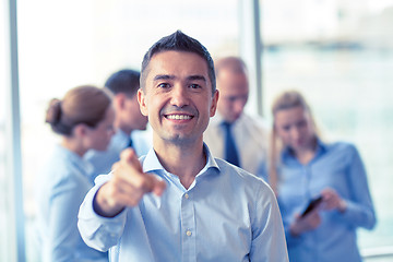 Image showing group of smiling businesspeople meeting in office