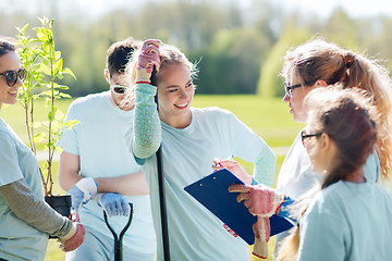 Image showing group of volunteers planting trees in park