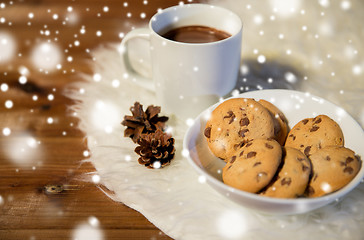 Image showing cups of hot chocolate with cookies on fur rug