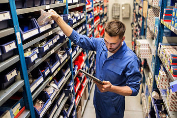 Image showing auto mechanic or smith with tablet pc at workshop