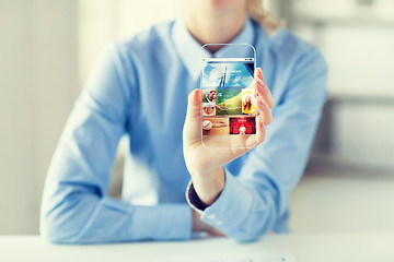 Image showing close up of woman with application on smartphone