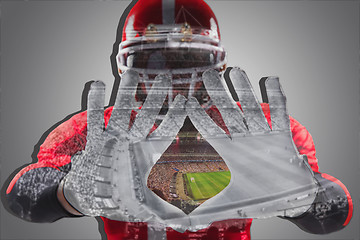 Image showing The hands of american football player on white 