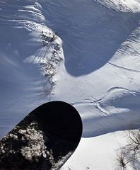 Image showing View from chair-lift on snowboard over off-piste slope