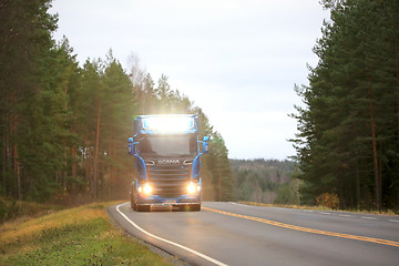 Image showing Blue Scania Lights Up Highway