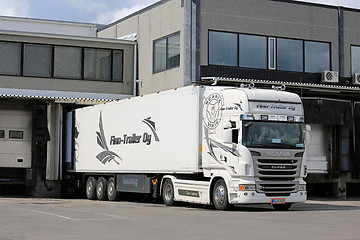 Image showing Scania Semi of Finn-Trailer Oy Unloads at Warehouse