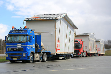 Image showing Fleet of Trucks Transport House Modules