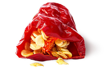 Image showing Closeup piece red hot chili pepper with seeds