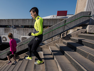 Image showing young  couple jogging on steps