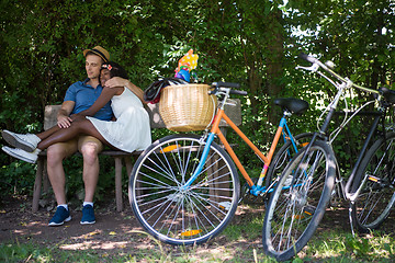 Image showing Young multiethnic couple having a bike ride in nature