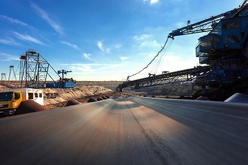 Image showing Long conveyor belt transporting ore