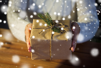 Image showing close up of woman with christmas gift or parcel