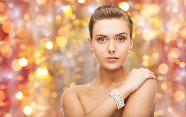 Image showing beautiful woman with pearl earrings and bracelet