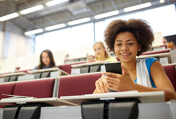 Image showing african student girl with smartphone at lecture