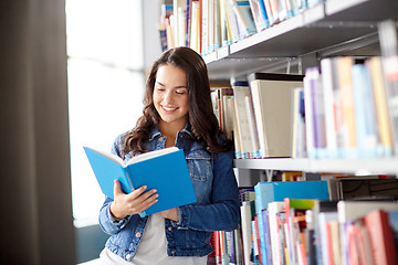 Image showing high school student girl reading book at library