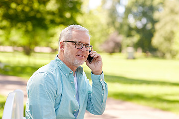 Image showing senior man calling on smartphone at summer park