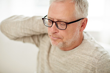 Image showing close up of senior man suffering from neck ache