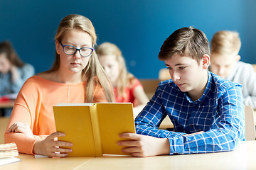 Image showing students reading book at school lesson