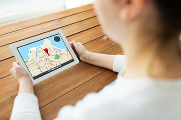 Image showing close up of woman with gps navigator on tablet pc
