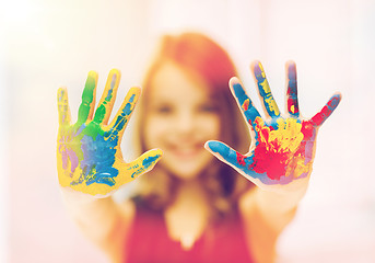 Image showing happy girl showing painted hands