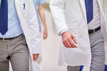 Image showing close up of medics or doctors walking in hospital