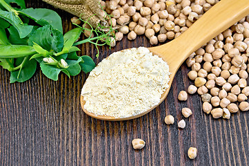 Image showing Flour chickpeas in spoonful with peas on board