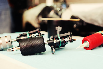 Image showing tattoo machine on the background of a  studio