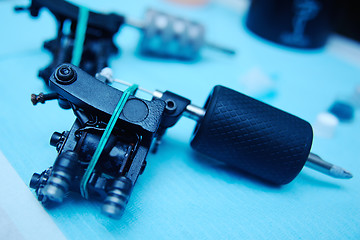 Image showing tattoo machine on the background of a  studio