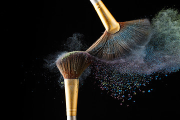 Image showing Cosmetical splash of powder from the special brushes