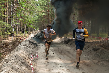 Image showing Sportsmen run between stages in extrim race.Tyumen