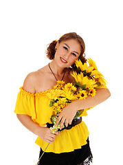 Image showing Beautiful woman with sunflowers.