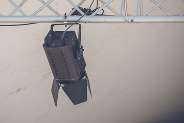 Image showing Spotlight lamp hanging on a metal stand