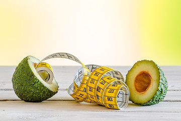 Image showing Healthy avocado with measure tape