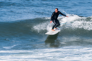 Image showing Surfing the waves