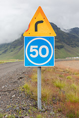 Image showing Curve with advisory speed limit