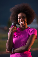 Image showing Portrait of a young african american woman running outdoors