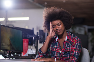 Image showing a young African American woman feels tired in the modern office