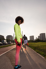 Image showing Portrait of sporty young african american woman running outdoors