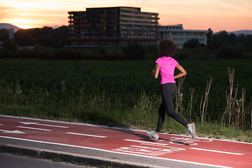 Image showing a young African American woman jogging outdoors