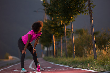 Image showing Portrait of a young african american woman running outdoors