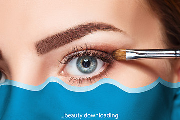 Image showing Beautiful female eyes with make-up and brush