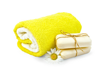 Image showing Soap white with chamomile and towels