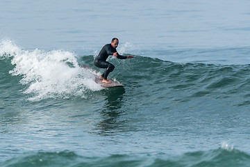 Image showing Surfing the waves