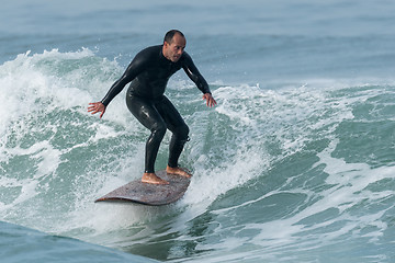 Image showing Surfing the waves