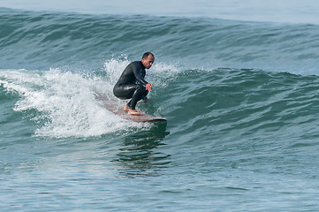 Image showing Surfing the waves